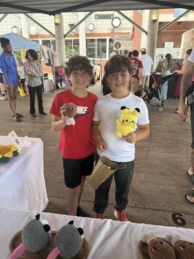 brothers holding a chicken leg and pikachu plushie