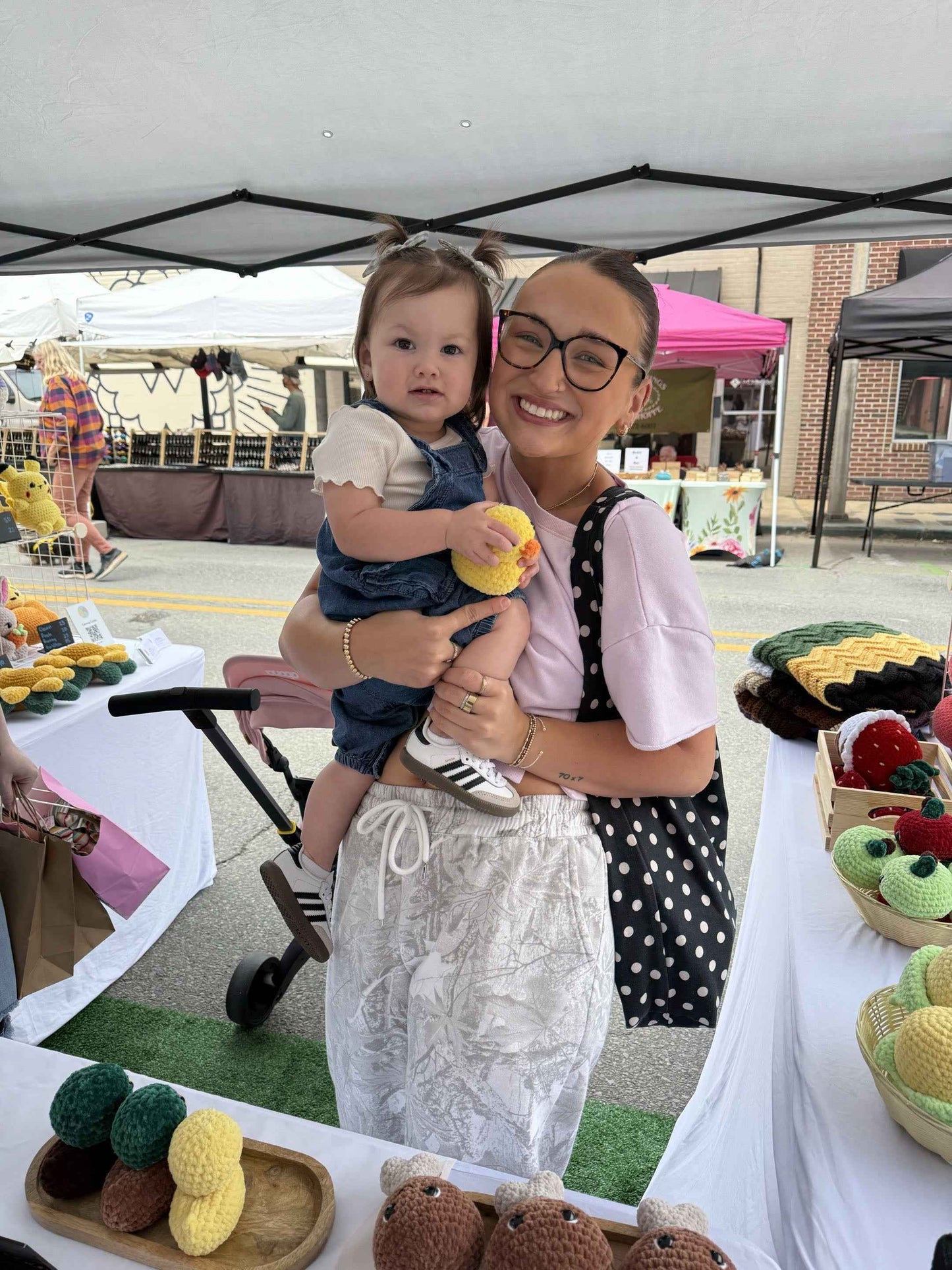 mom and daughter with a duck plushie