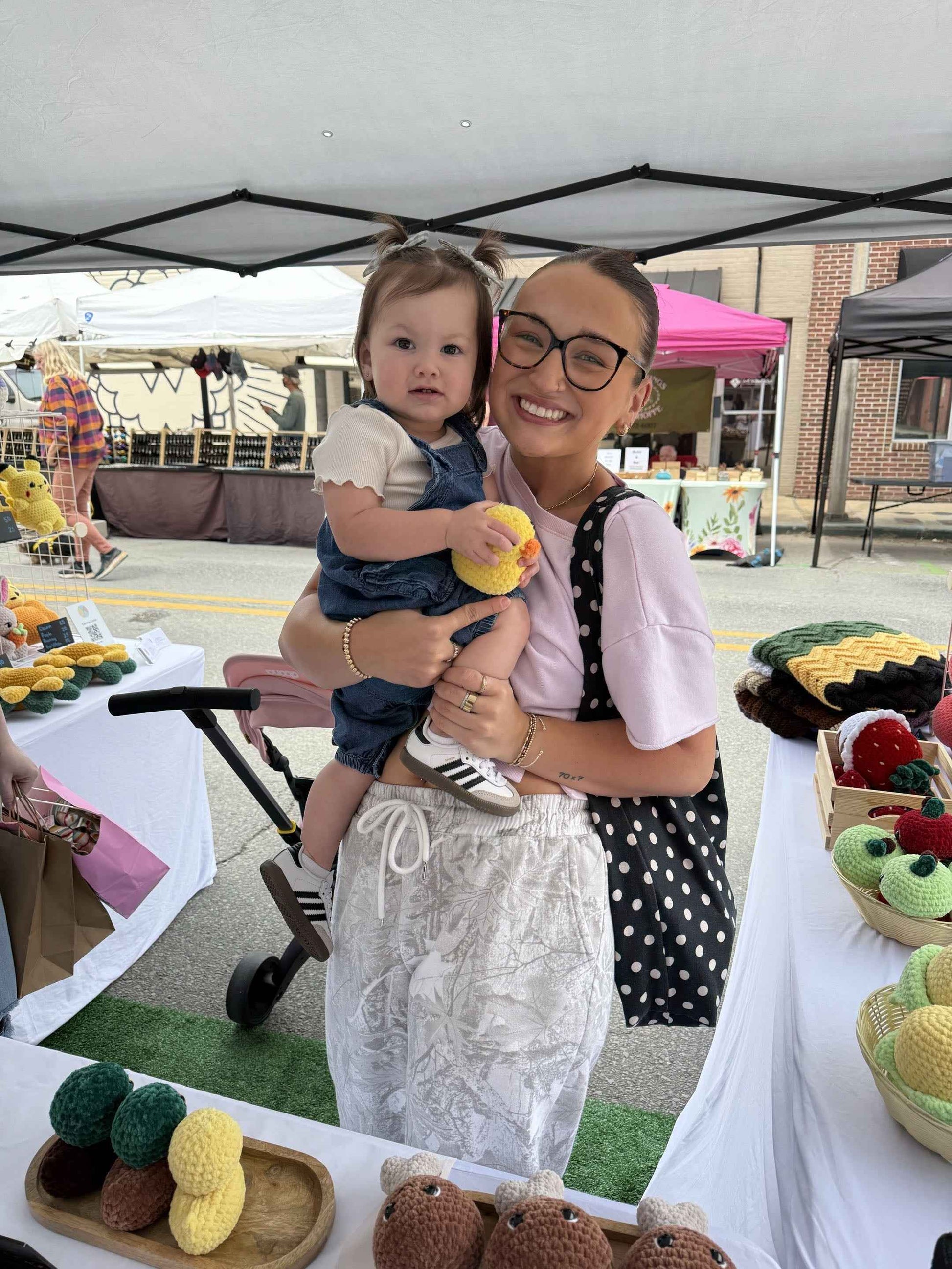 mom and daughter with a duck plushie