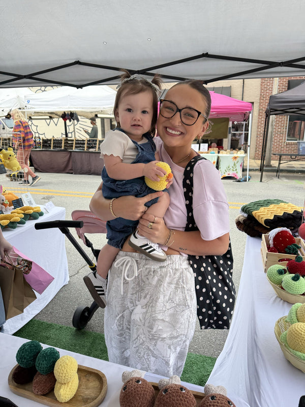 mom and daughter with a duck plushie